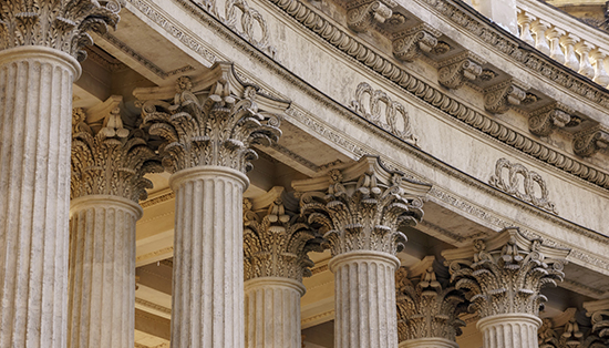 Close-up view of a courthouse with tall columns.